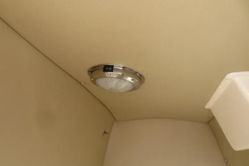 Slide: The Image of 2016 Grady-White Fisherman 209 boat interior with seating and control panel. - 24