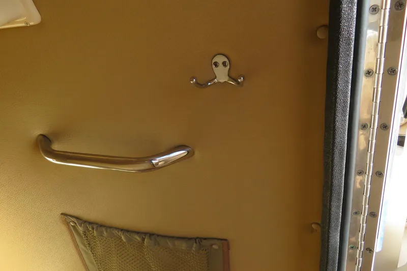 Slide: The Image of 2016 Grady-White Fisherman 209 boat interior with seating and storage compartment. - 25