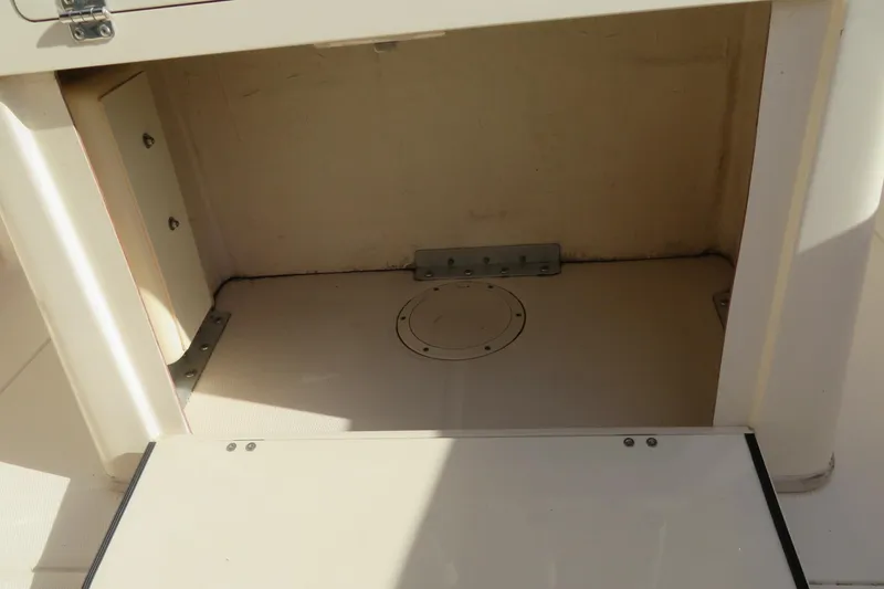 Slide: The Image of 2016 Grady-White Fisherman 209 boat interior with Yamaha engine and caution label. - 32