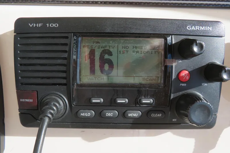 Slide: The Image of 2016 Grady-White Fisherman 209 dashboard with Garmin electronics and steering wheel. - 39