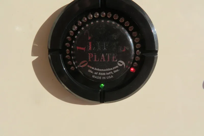 Slide: The Image of Bennett trim tab control panel on 2016 Grady-White Fisherman 209 boat. - 50