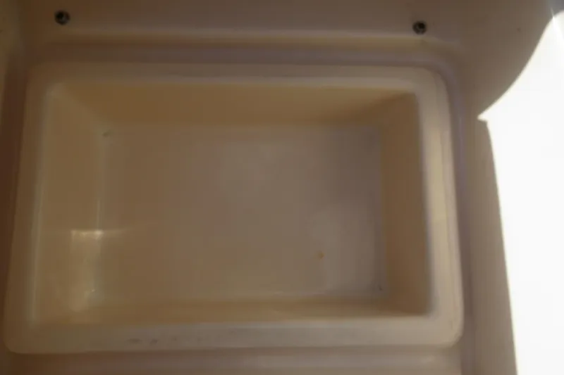 Slide: The Image of 2016 Grady-White Fisherman 209 boat interior with beige upholstery and windshield. - 56