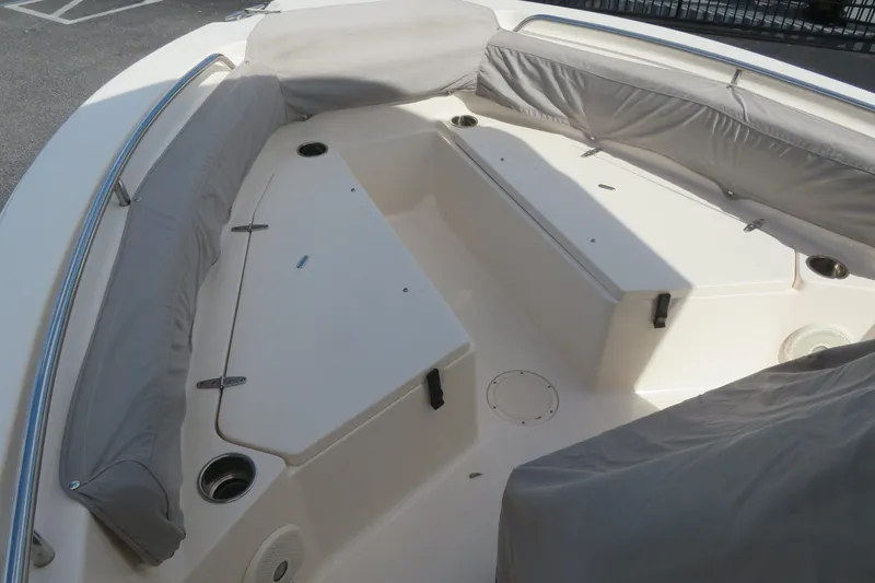 Slide: The Image of 2016 Grady-White Fisherman 209 boat interior with cushioned seating and storage compartments. - 66