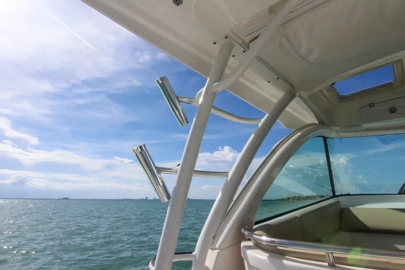 Slide: The Image of 2016 Pursuit OS 385 Offshore boat interior with ocean view and clear blue sky. - 44