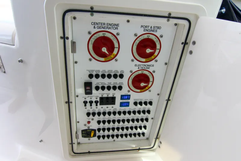 Slide: The Image of Electrical control panel on a 2016 Pursuit OS 385 Offshore boat. - 46