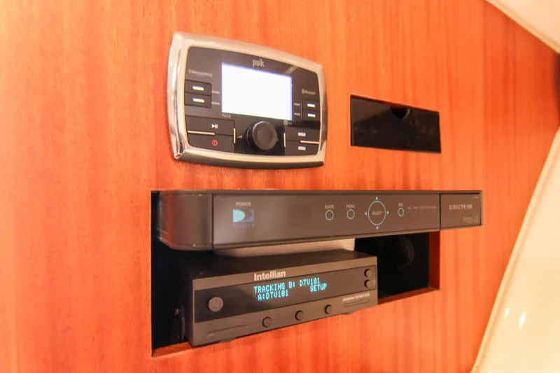 Slide: The Image of 2016 Pursuit OS 385 Offshore entertainment system with Polk audio and DirecTV setup. - 56