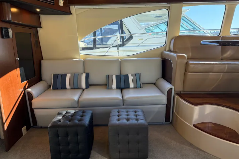 Slide: The Image of Luxurious interior of 2006 Sea Ray 44 Sedan Bridge yacht with modern seating. - 10