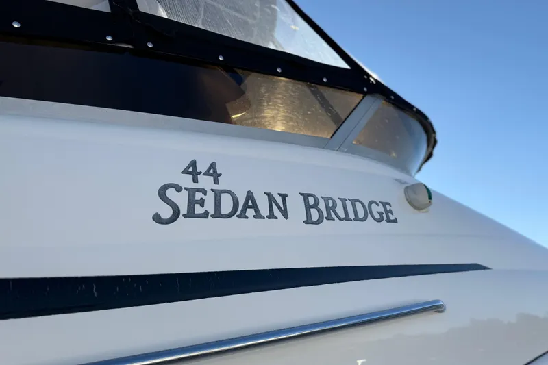 Slide: The Image of 2006 Sea Ray 44 Sedan Bridge yacht, close-up view of model name. - 102