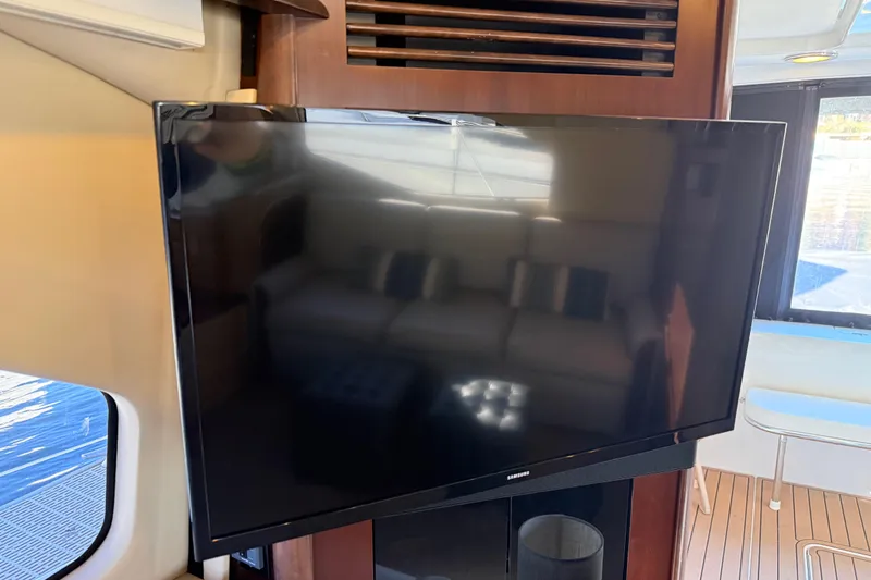 Slide: The Image of Flat-screen TV inside 2006 Sea Ray 44 Sedan Bridge yacht interior. - 15