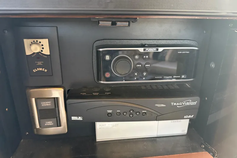 Slide: The Image of Control panel of a 2006 Sea Ray 44 Sedan Bridge with stereo and navigation systems. - 16