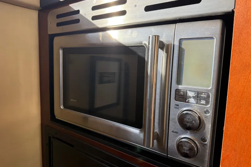 Slide: The Image of Built-in microwave in 2006 Sea Ray 44 Sedan Bridge yacht kitchen. - 27