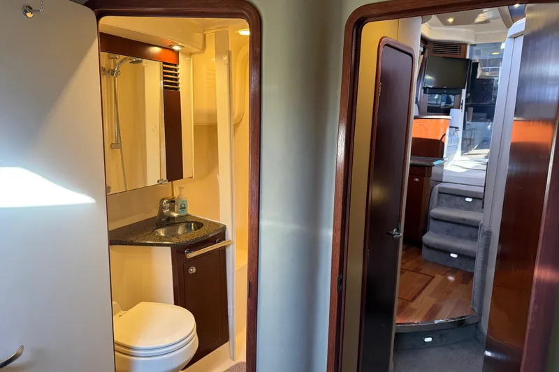 Slide: The Image of Interior of 2006 Sea Ray 44 Sedan Bridge showing bathroom and cabin area. - 43