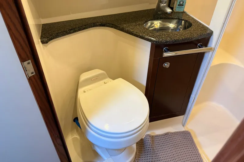 Slide: The Image of Bathroom interior of 2006 Sea Ray 44 Sedan Bridge with toilet and sink. - 45