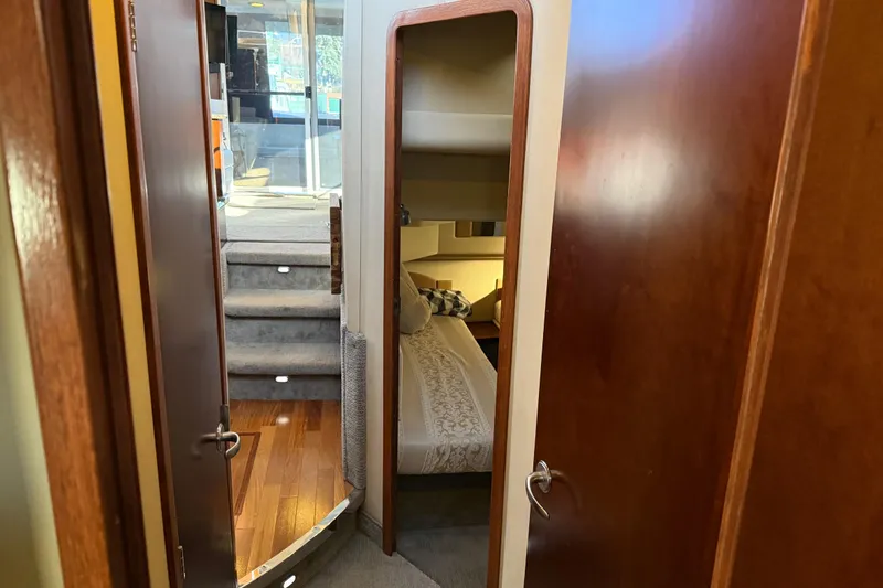 Slide: The Image of Interior view of 2006 Sea Ray 44 Sedan Bridge yacht with cozy bedroom and stairs. - 48