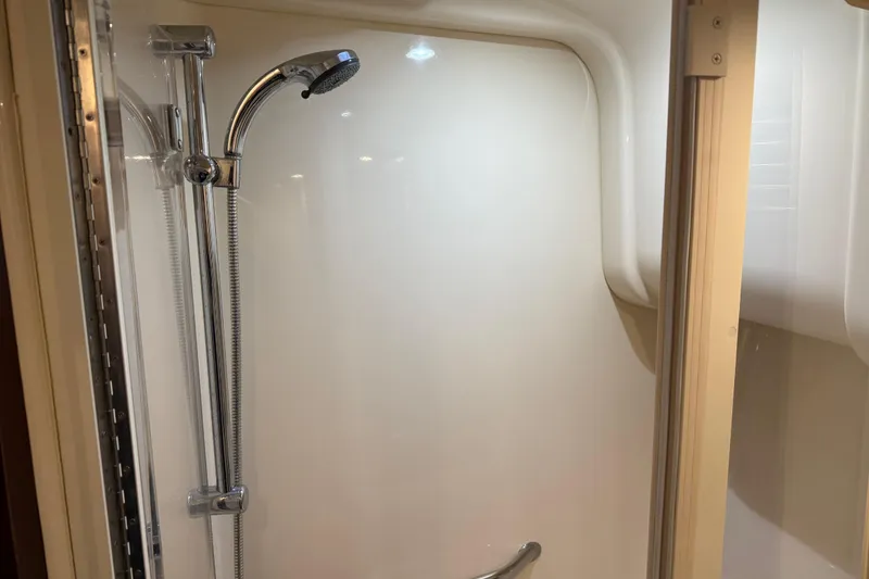 Slide: The Image of Shower area in 2006 Sea Ray 44 Sedan Bridge yacht, featuring chrome fixtures. - 56