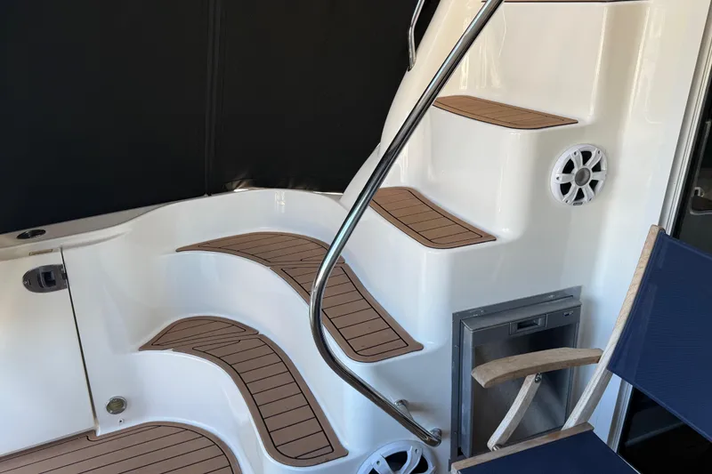 Slide: The Image of Staircase on 2006 Sea Ray 44 Sedan Bridge yacht with wood accents and seating. - 60