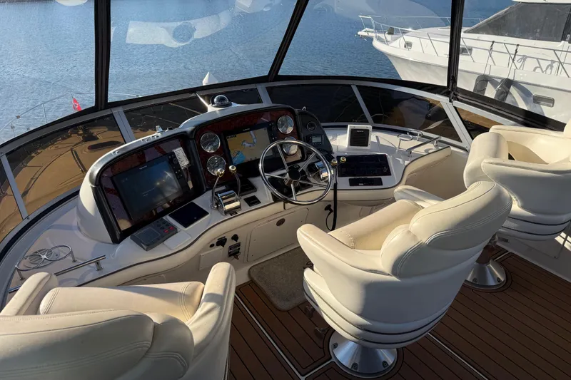 Slide: The Image of Luxurious helm of 2006 Sea Ray 44 Sedan Bridge yacht with modern navigation equipment. - 61
