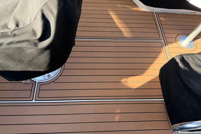 Slide: The Image of Teak deck of 2006 Sea Ray 44 Sedan Bridge with covered seating. - 63