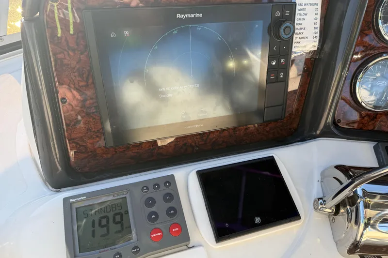 Slide: The Image of Control panel of 2006 Sea Ray 44 Sedan Bridge with Raymarine navigation system. - 65
