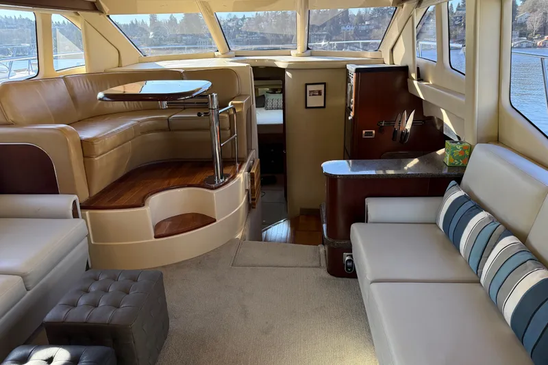Slide: The Image of Luxurious interior of 2006 Sea Ray 44 Sedan Bridge yacht with elegant seating and panoramic windows. - 7