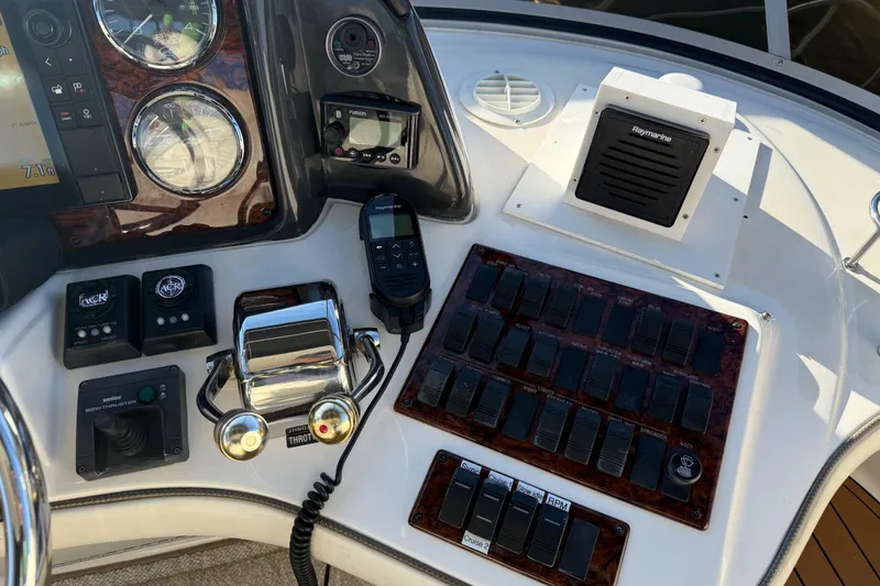 Slide: The Image of Control panel of a 2006 Sea Ray 44 Sedan Bridge yacht with navigation instruments. - 71
