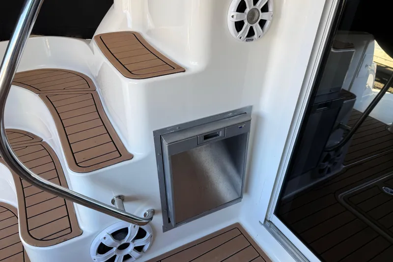 Slide: The Image of 2006 Sea Ray 44 Sedan Bridge boat interior with steps and speaker. - 79