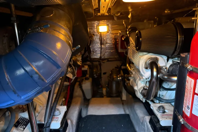 Slide: The Image of Engine room of 2006 Sea Ray 44 Sedan Bridge with visible components and equipment. - 83