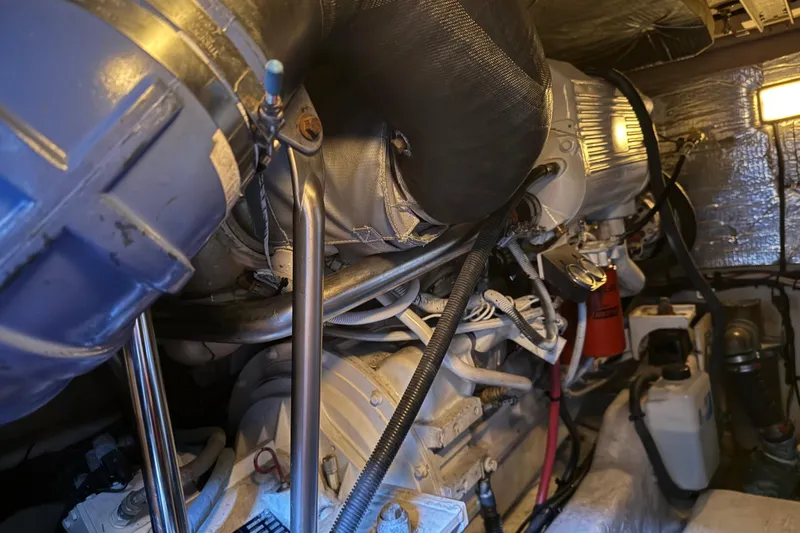 Slide: The Image of Engine room of 2006 Sea Ray 44 Sedan Bridge yacht, showcasing mechanical components. - 84