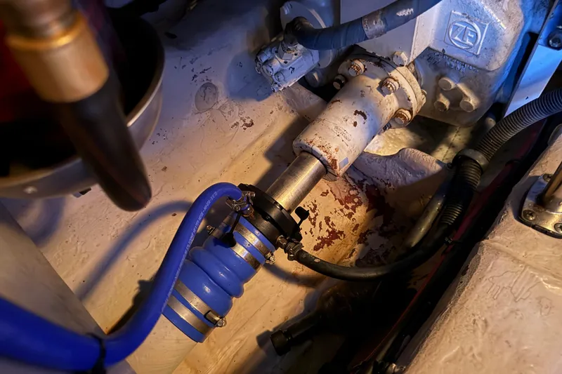 Slide: The Image of Engine compartment of 2006 Sea Ray 44 Sedan Bridge with visible mechanical components. - 86