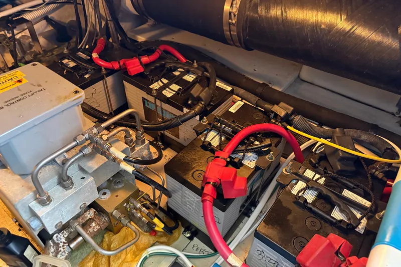 Slide: The Image of Engine room of 2006 Sea Ray 44 Sedan Bridge showing batteries and wiring. - 88