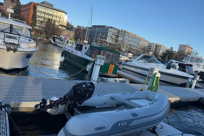Slide: The Image of Boats docked at marina, featuring a 2006 Sea Ray 44 Sedan Bridge. - 96