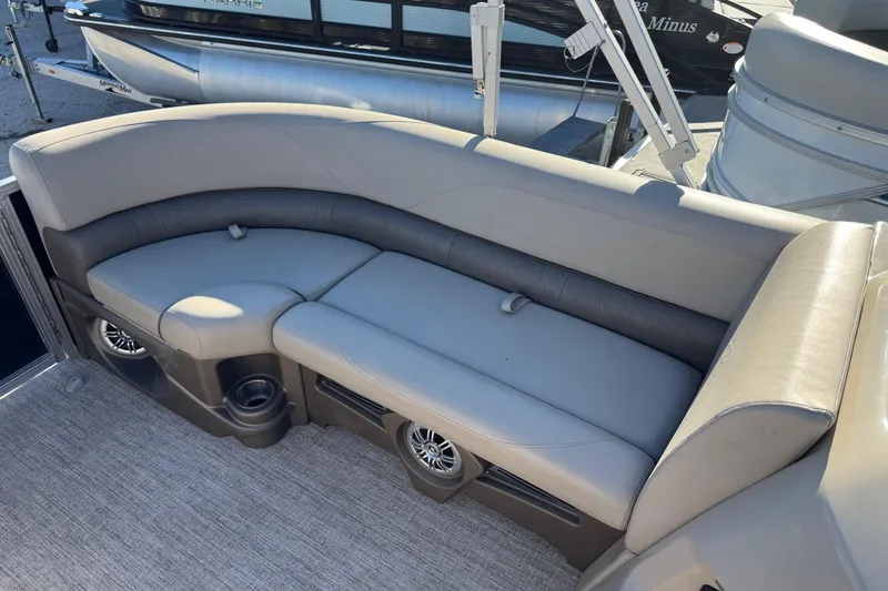 Slide: The Image of 2021 Avalon LSZ 2485 boat interior with gray seating and cup holders. - 10