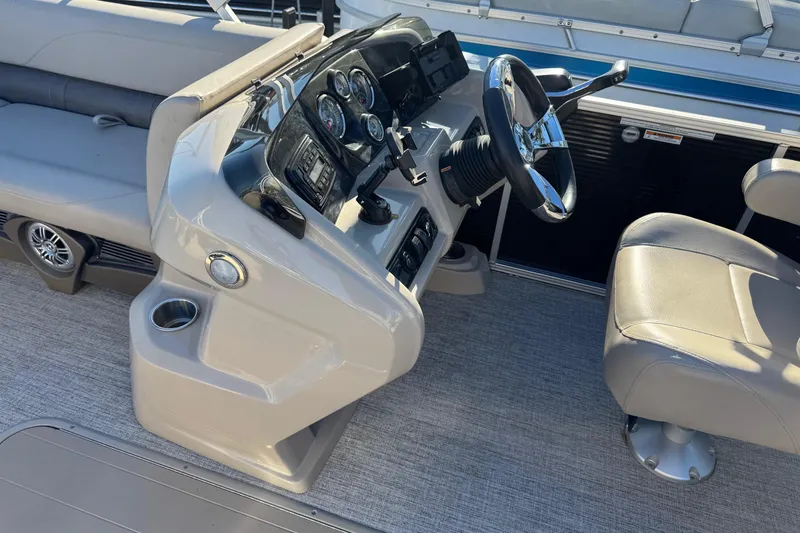 Slide: The Image of 2021 Avalon LSZ 2485 boat interior with steering console and seating. - 17