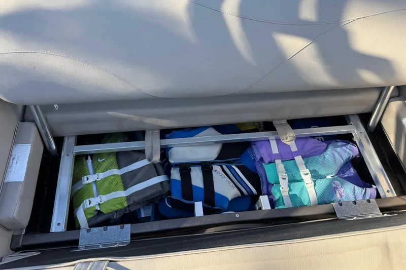 Slide: The Image of Storage compartment in 2021 Avalon LSZ 2485 boat with life jackets. - 23