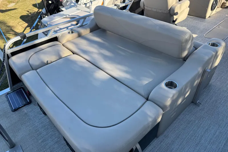 Slide: The Image of Luxurious seating on 2021 Avalon LSZ 2485 pontoon boat with cup holders. - 24