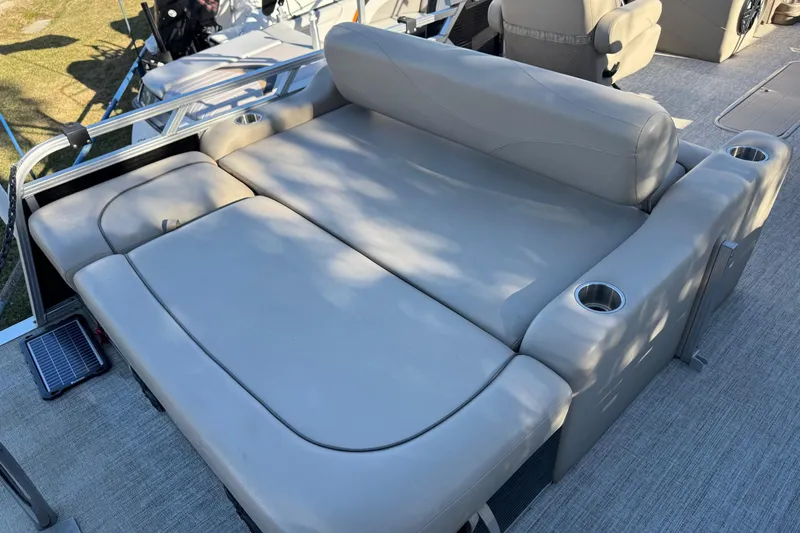 Slide: The Image of Luxurious seating on 2021 Avalon LSZ 2485 pontoon boat with cup holders and plush cushions. - 25
