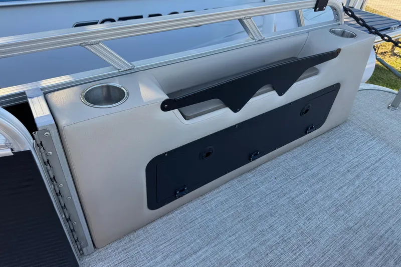 Slide: The Image of 2021 Avalon LSZ 2485 boat interior with cup holders and storage compartment. - 27