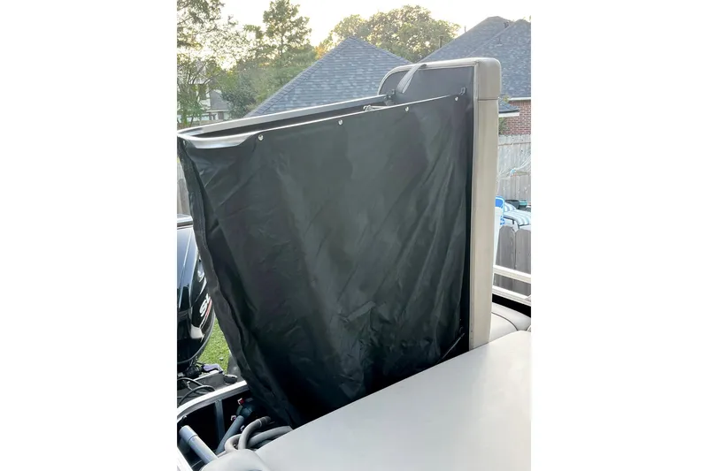 Slide: The Image of 2021 Avalon LSZ 2485 boat interior with beige seating and cup holders. - 8