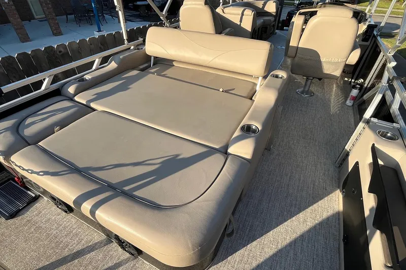 Slide: The Image of 2021 Avalon LSZ 2485 pontoon boat with spacious seating and modern design. - 9