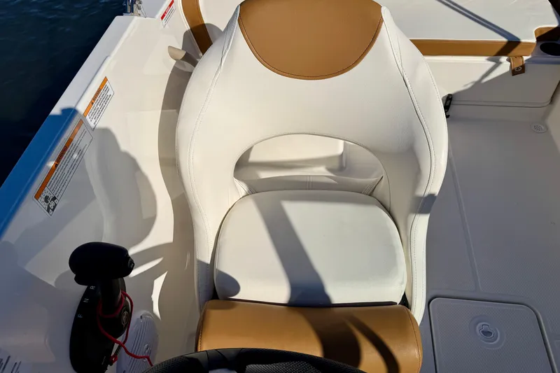 Slide: The Image of 2023 Bayliner VR4 Bowrider OB boat seat with tan and white upholstery. - 12