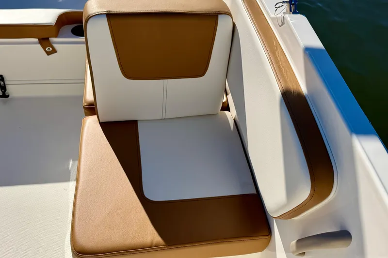 Slide: The Image of 2023 Bayliner VR4 Bowrider OB seat with tan and white upholstery. - 14
