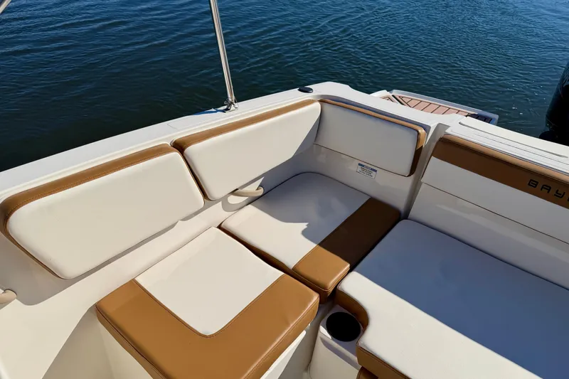 Slide: The Image of 2023 Bayliner VR4 Bowrider OB interior seating with tan and white upholstery. - 19