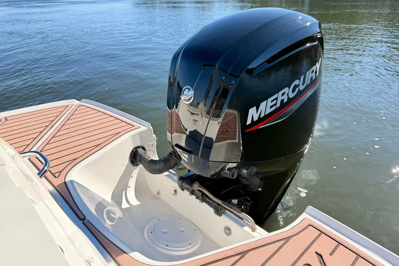 Slide: The Image of 2023 Bayliner VR4 Bowrider OB with Mercury outboard engine on water. - 24