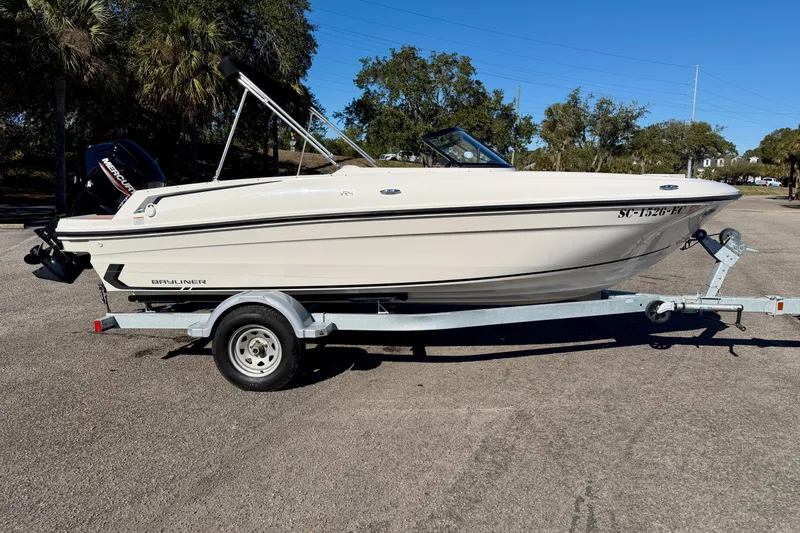 Slide: The Image of 2023 Bayliner VR4 Bowrider OB on trailer, parked outdoors, side view. - 27