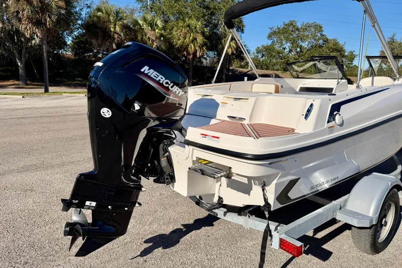 Slide: The Image of 2023 Bayliner VR4 Bowrider OB with Mercury outboard engine on trailer. - 31