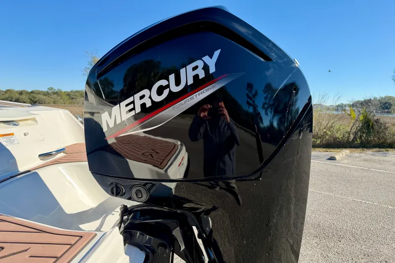 Slide: The Image of 2023 Bayliner VR4 Bowrider OB with Mercury outboard motor, parked outdoors. - 32