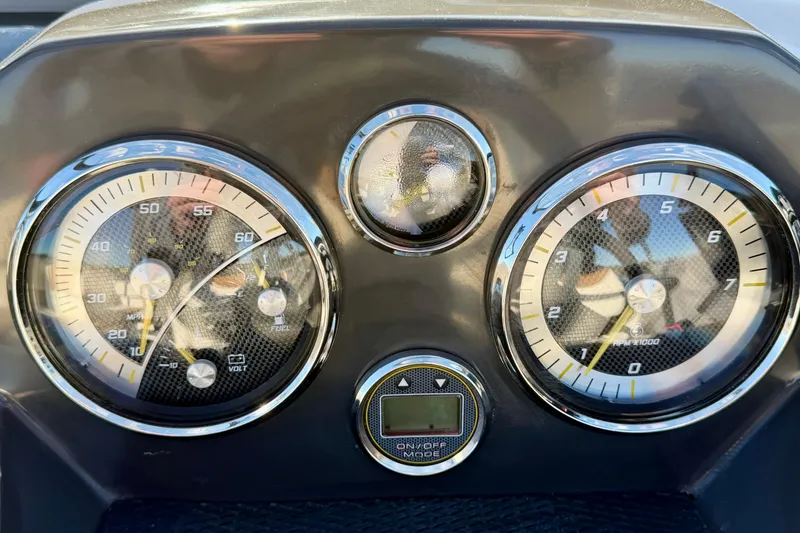 Slide: The Image of Dashboard of 2023 Bayliner VR4 Bowrider OB with speedometer and tachometer gauges. - 6