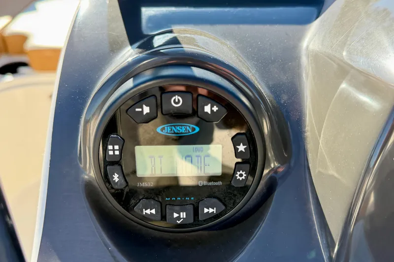 Slide: The Image of Jensen marine audio system on 2023 Bayliner VR4 Bowrider OB boat dashboard. - 7
