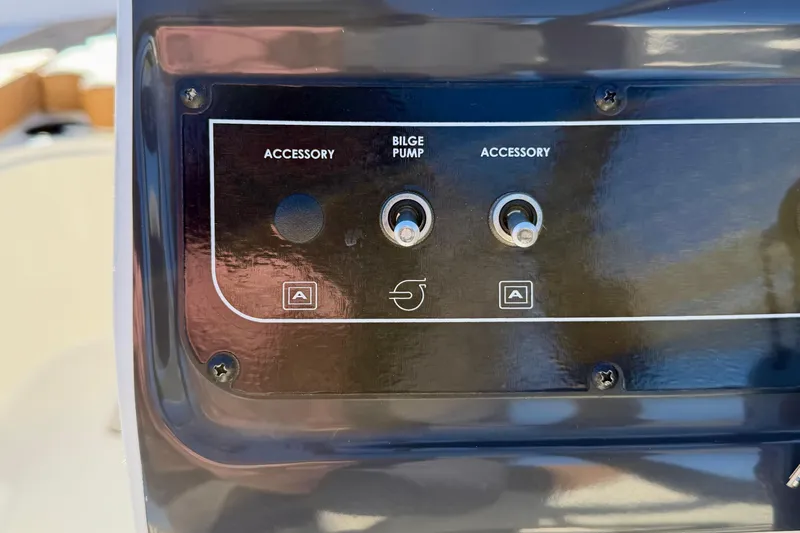 Slide: The Image of Control panel of 2023 Bayliner VR4 Bowrider OB with bilge pump and accessory switches. - 8