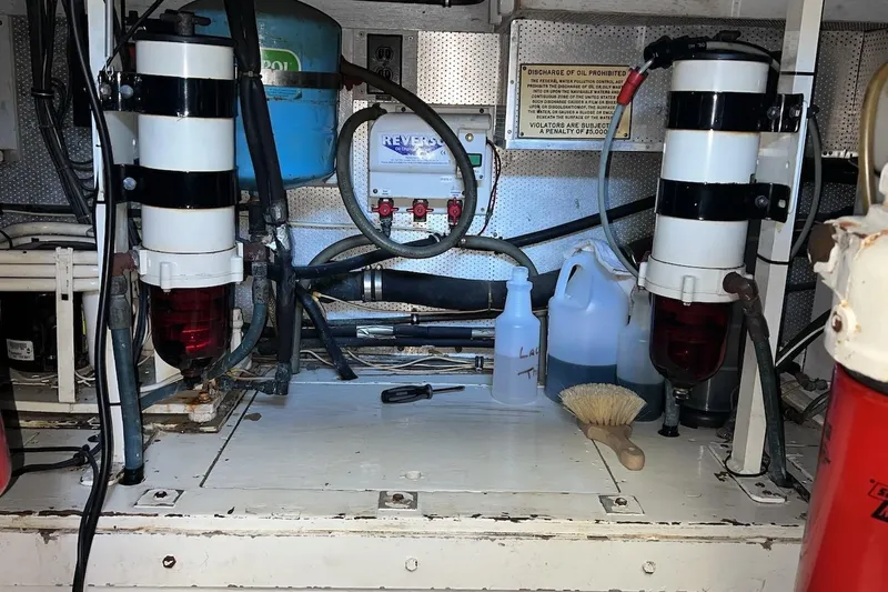 Slide: The Image of Engine room of a 1980 Bertram 42 Convertible boat with maintenance tools and equipment. - 20